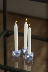 Set of stone Candle Holder with abstract smudges, blue concrete with silver flame. selective soft focus