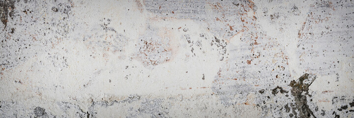Vintage wall texture. Weathered rough surface of the wall. Wide panoramic texture for background and design.