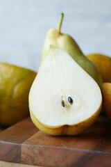 slice of fresh pears on table close up 