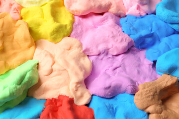Different color play dough as background, closeup