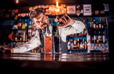 Barman makes a cocktail on the beerhall