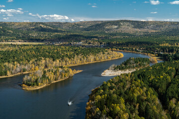 The boat is sailing along the Irkut river