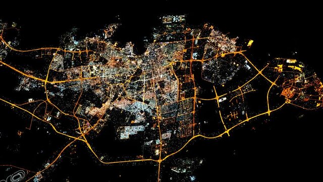 Night light city of Doha, Qatar, view from space with flashing lights. Images furnished by Nasa