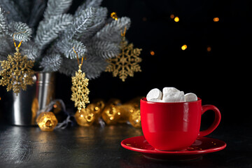 Marshmallows and a cup of latte on the background of Christmas tree