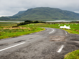 Fototapeta na wymiar Scenic road leading to Skalholt Cathedral in Skalholt, Iceland