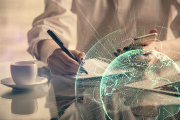 Double exposure of social network sketch hologram and woman holding and using a mobile device.