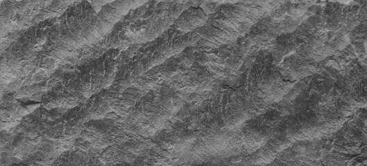 Abstract texture of the stone wall. Close-up. Light gray rock backdrop.