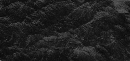 Fototapeta premium Dark gray stone background with copy space. Black grunge banner with rock texture.