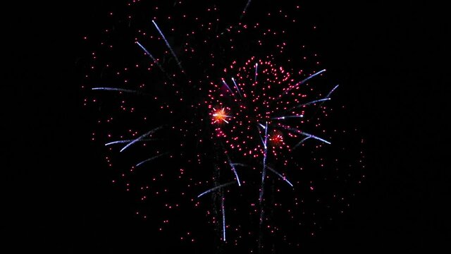 firework display. shining fireworks with bokeh lights in night sky. glowing fireworks show.