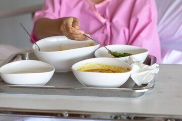 The doctor with PPE suit, Doctor is using a test coronavirus(covid-19) with the use of an ATK test kit by nasal swab.
