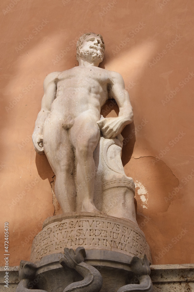 Wall mural Statue of Saturn, a god in ancient Roman religion, on a fountain in Trapani, Sicily