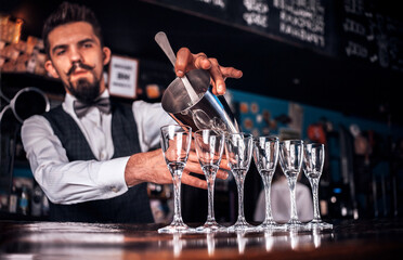 Barman creates a cocktail at the beerhouse