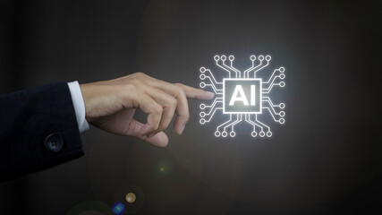 Naklejka premium Hud and innovation concept, Businessman hand pointing at abstract blue AI chip on blurry background. 