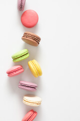 Colorful cake macaron or macaroon on white background. Sweet background. Flat lay, top view, copy space