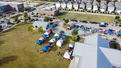 Top view colorful tents on grass lawn square at Farmer Market at Coppell Downtown, Texas, USA