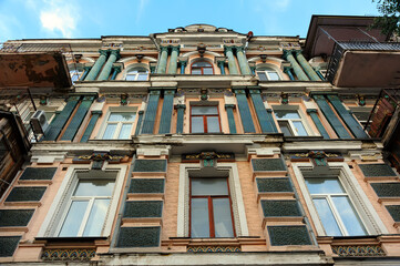 Fototapeta na wymiar Glazed majolica decorations of old building facade in Kyiv Ukraine