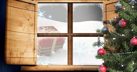 Digitally generated image of christmas tree by window at home