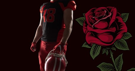 Midsection of male american footballer holding helmet by rose against black background