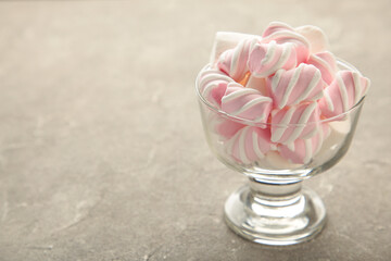 Marshmallow in bowl on grey background. Sweet food dessert.