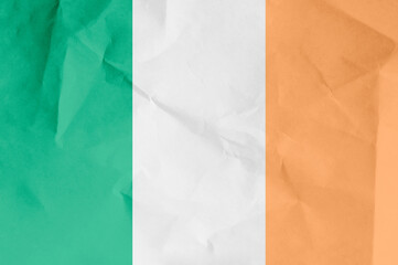 The flag of Ireland flies in the wind. State symbol of the Irish people. National sign of Ireland