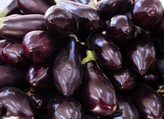 Fresh eggplant on market counter