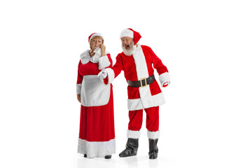 Portrait of two people, man in Santa Claus costume and crying woman, missis Claus isolated on white background.