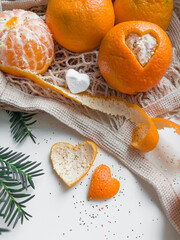 Still life with tangerines and sweet dessert. Tangerines and heart shaped marshmallow slices