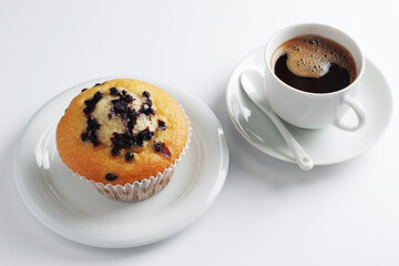 Blueberry muffin and coffee
