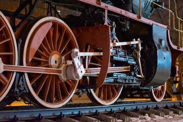 Fototapeta na wymiar wheels of an old steam locomotive close-up