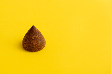 bitter chocolate candies truffle in cocoa, cocoa candies with a minimum amount of sugar, closeup of...