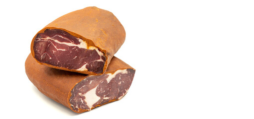 Turkish pastrami on a white background. Bacon made from veal. Turkish bacon, pastrami (Kayseri pastirma). Empty space for text. copy space