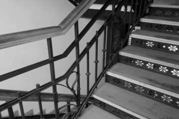Black and white photo. Beautiful staircase in an old house.