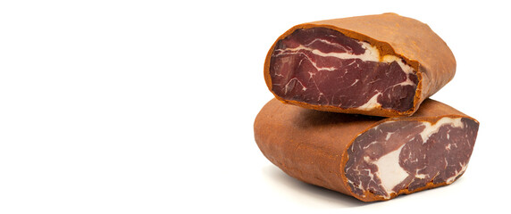 Turkish pastrami on a white background. Bacon made from veal. Turkish bacon, pastrami (Kayseri pastirma). Empty space for text. copy space