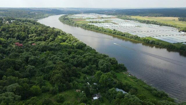Russia, Pushchino. Aerial video of a drone flying over the Oka River at sunny day. A river in the European part of Russia, the largest right tributary of the Volga River.