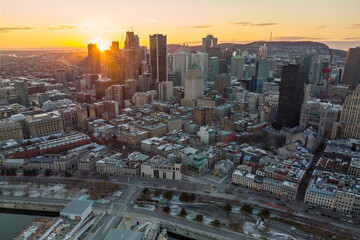 Naklejka na ściany i meble Sunset behind the building of Montreal city 