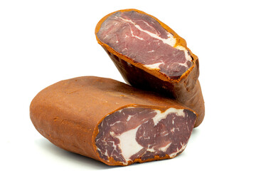 Turkish pastrami on a white background. Bacon made from veal. Turkish bacon, pastrami (Kayseri pastirma). Horizontal view. close up