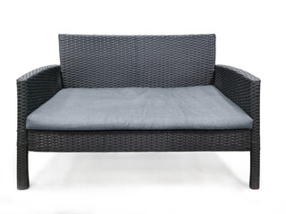 Gray rattan sofa with gray cushions for home decoration on white background