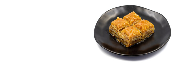 Walnut Baklava on white background. Turkish style walnut baklava presentation and service. Empty...