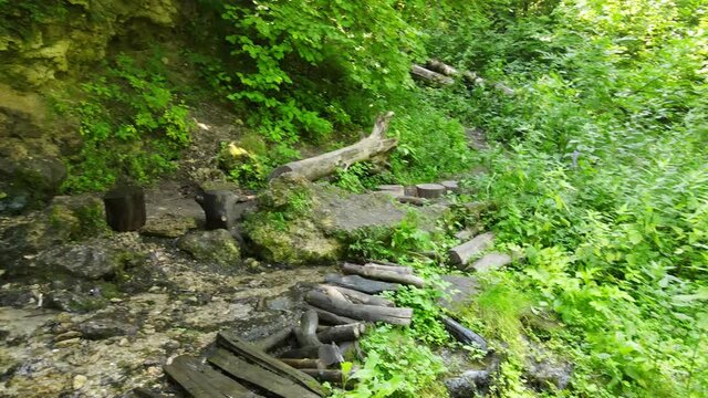 Russia, Pushchino on the Oka River. A beautiful waterfall near Moscow in the summer. Aerial Video of Eco trail and green vegetation.