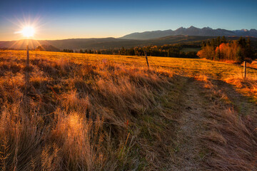 A beautiful sunrise over the Tatra Mountains . The pass over Lapszanka in Poland.