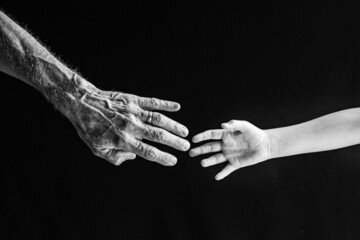 Old and Young Hands Reaching Out for One Another