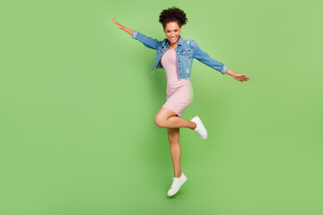 Full size photo of funny millennial lady jump wear dress shirt sneakers isolated on green background