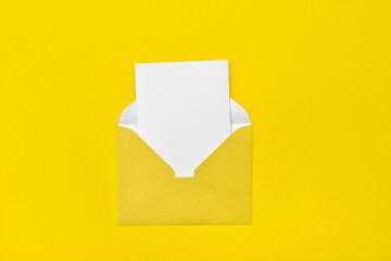 yellow open envelope  on a yellow background  with a note inside. Place for your text. Delivery...