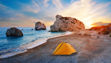 Orange tourist tent on the beach of Aphrodite in Cyprus © alexlukin