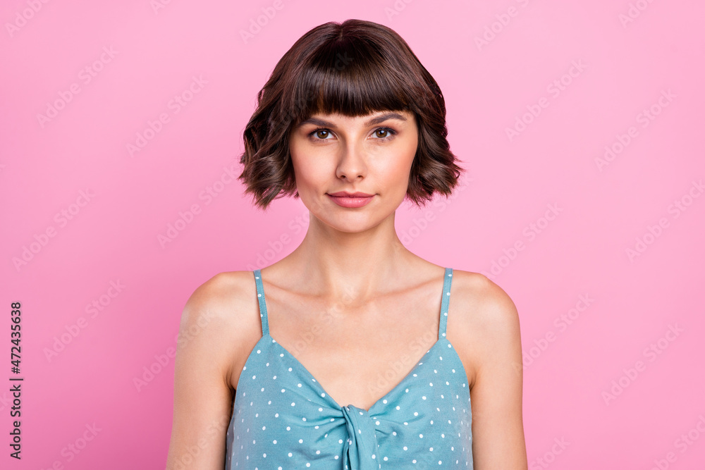 Poster Portrait of attractive content brown-haired girl wearing dotted tanktop isolated over pink pastel color background