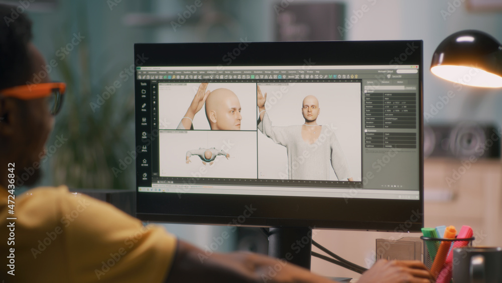 Poster black guy creating 3d model of bald human for movie or video game on computer during work in home of