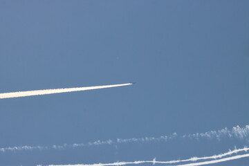 blue sky with passage and air trail