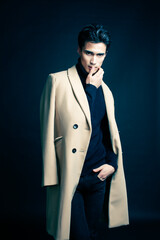 handsome asian fashion looking man posing in studio on black background, lifestyle modern people concept