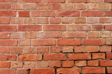Weathered texture of stained old dark brown and red brick wall background,