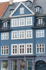 Fototapeta na wymiar Copenhagen, Denmark - October 1, 2021: Detail of the facade of a house in Nyhavn, in the historical center of Copenhagen